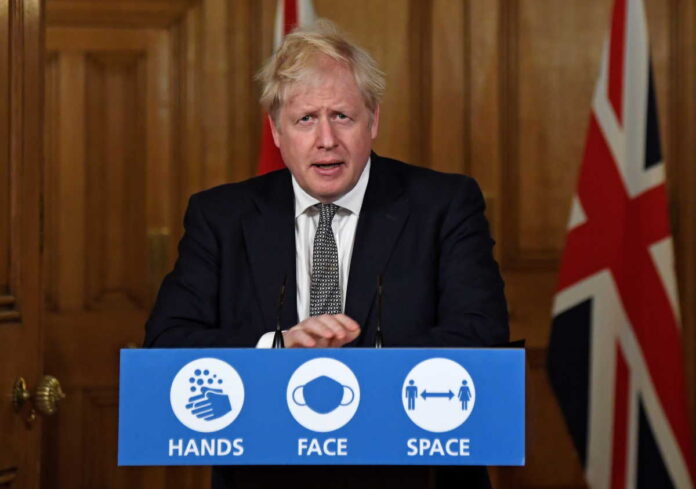 Britain's Prime Minister Boris Johnson speaks during a press conference at 10 Downing Street in London